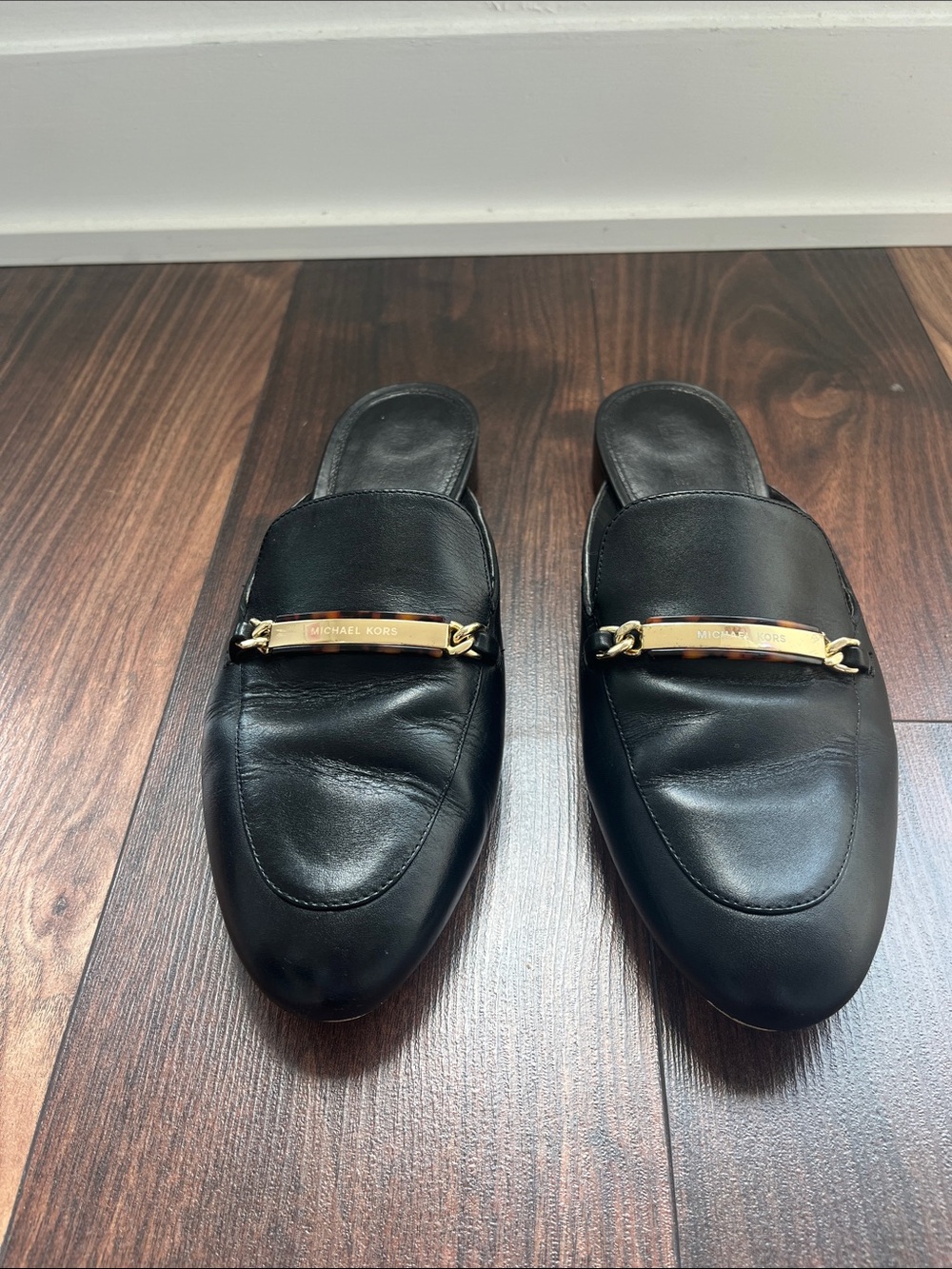 Michael Kors Black Leather Backless Loafers with Gold Bar - Size 9/39